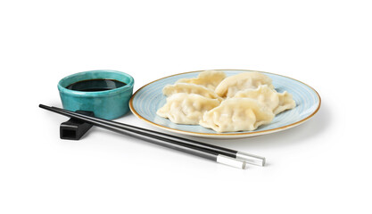 Tasty gyoza (dumplings), soy sauce and chopsticks isolated on white
