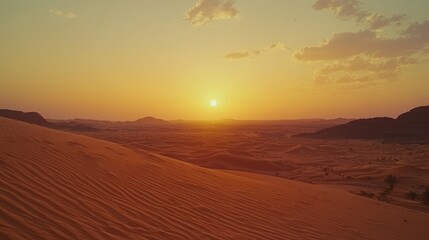 Desert sunset over rolling sand dunes.