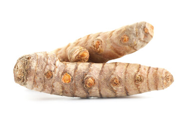 Two fresh turmeric roots isolated on white