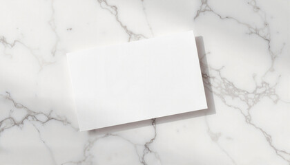 Blank white card mockup on marble backdrop for branding or creative design purposes