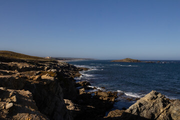 Stunning view of dramatic cliffs and the vast ocean in Porto Covo, Portugal, showcasing the power of nature and the serene beauty of the coastline
