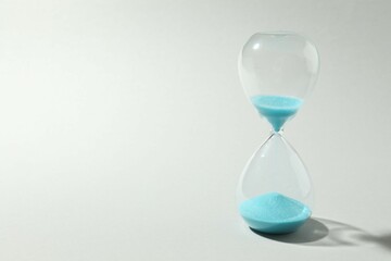 Modern hourglass on gray background. Hourglass time concept for business deadline, urgency and outcome of time
