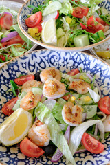 Shrimp and vegetable salad with lemon wedges a refreshing and healthy meal