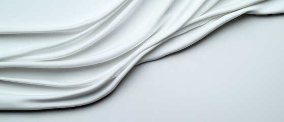 Obraz premium Sanfte Wellen von weißem Stoff auf glattem Untergrund