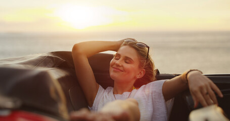 Happy, woman and relax in car for road trip adventure, ocean travel and vacation destination. Smile, female person and carefree with vehicle of journey transport, summer getaway and outdoor freedom