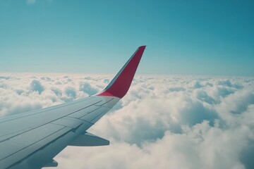 Obraz premium View of airplane wing above fluffy clouds under bright blue sky during a sunny flight. Generative AI