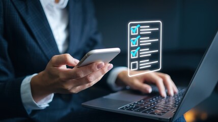 Efficient Task Management: Businesswoman using technology to check off items on her to-do list.
