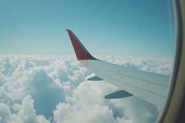 Obraz premium Experience the serenity of flying above fluffy clouds with a view through the airplane window. Generative AI
