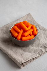 Organic Baby Carrots in a Bowl, side view.