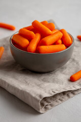 Organic Baby Carrots in a Bowl, side view.