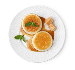 Tasty puddings with caramel sauce and mint isolated on white, top view
