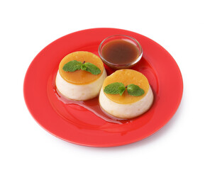 Tasty puddings with caramel sauce and mint isolated on white