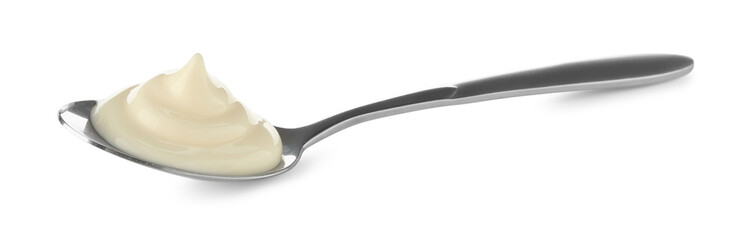 Tasty mayonnaise sauce in spoon isolated on white