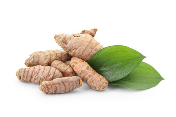 Raw turmeric roots and green leaves isolated on white