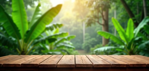 Obraz premium Wooden table sits in front of green jungle. Sunlight filters through banana trees, foliage. Peaceful, tranquil rural scene. Suitable for product placement, nature theme, eco lifestyle concepts. Ideal