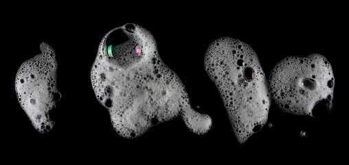 Soap foam isolated on black, with clipping path, texture and background, top view	