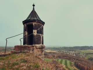 Historic watchtower at Königstein Fortress in Saxony, Germany. This old stone structure with a...