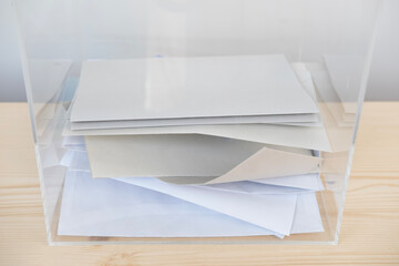 election ballot paper in transparent ballot box, political parties, voting rights, civic duty,...