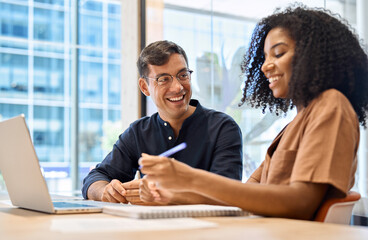 Diverse happy young business people two coworkers working together using laptop computer technology...