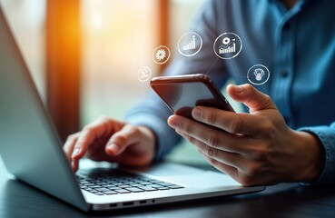 Businessperson uses smartphone with virtual tech icons displayed. Person uses laptop, smartphone simultaneously. Virtual icons show tech concepts like consulting, automation, data visualization.