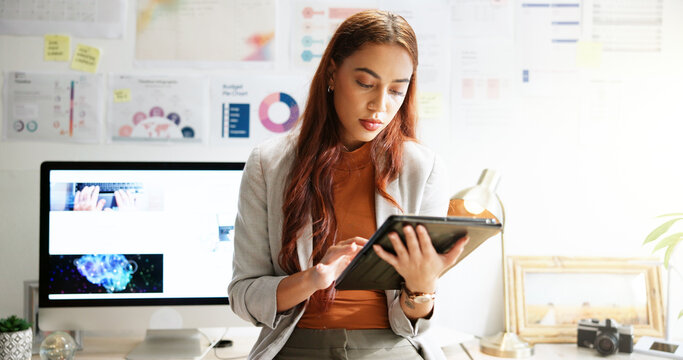 Typing, reading and tablet with business woman in office for research, company shares and profit margin. Data report, finance growth and infographic with person in agency for statistics and chart