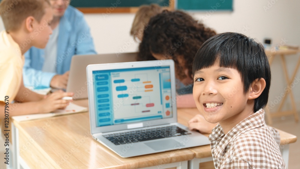 Poster energetic asian boy coding program and looking at camera in stem class while caucasian teacher and d