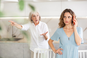 Elderly mother kicks her out of house and yells at her adult daughter while she is talking on a...