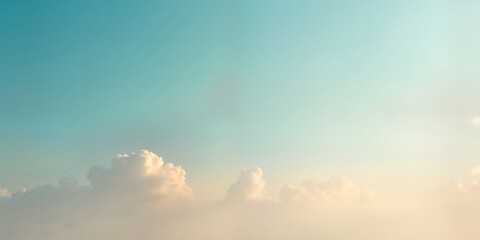 Obraz premium Soft light blue, beige gradient sky with fluffy clouds. Minimalist, serene scene ideal for various uses. Beautiful pastel colors. Gentle gradient transition. Simple, clean design. Great background