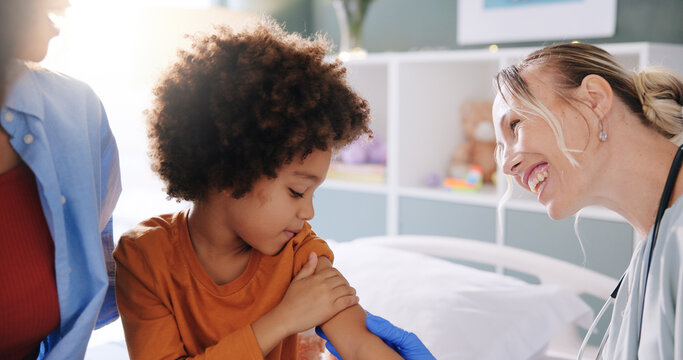 Doctor, child and smile for injection, vaccination and hospital support for health examination. Pediatrician, medical expert and boy for consultation, immunization and flu shot healthcare appointment