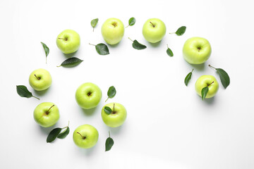 Flat lay composition with fresh apples and green leaves on white background