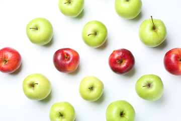 Red and green apples on white background, flat lay