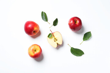 Flat lay composition with whole and cut apples on white background