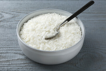Soy wax in bowl on grey wooden table