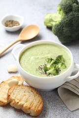 Delicious broccoli cream soup served on light table