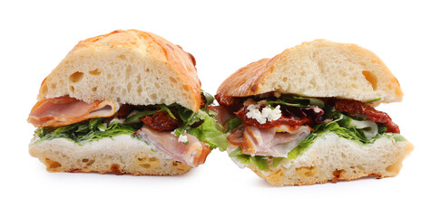 Delicious sandwiches with prosciutto and sun dried tomatoes isolated on white