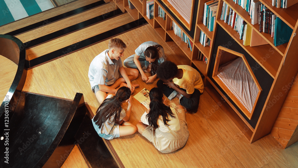 Poster top view of diverse children sitting in circle while looking at camera and waving hands at library s