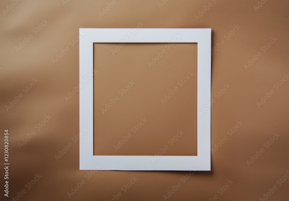 Poster white frame creating a square empty space on a brown textured background, providing a minimalist bac