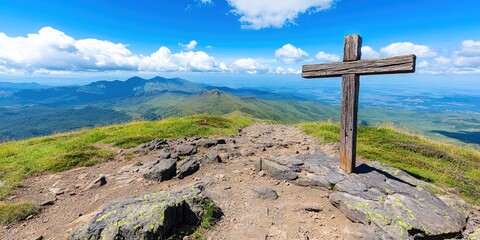wooden cross on a mountain 
