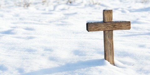 wooden cross in snow 