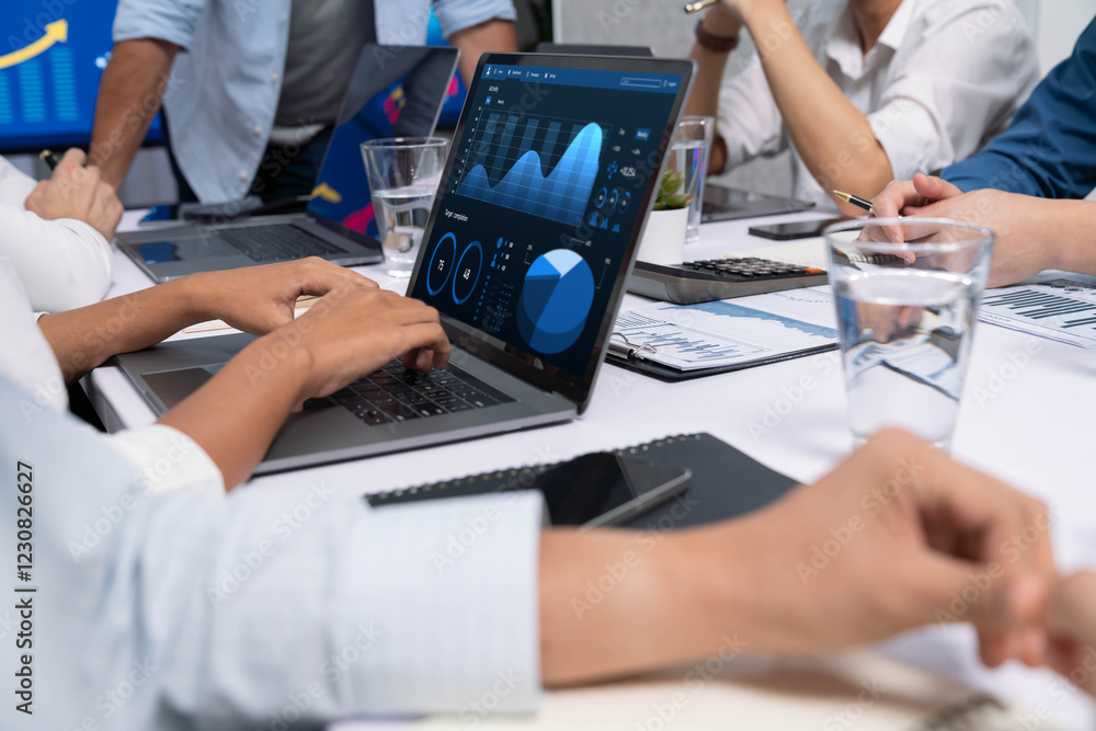 Fototapete analyst team utilizing bi fintech to analyze financial data at table in meeting room. businesspeople