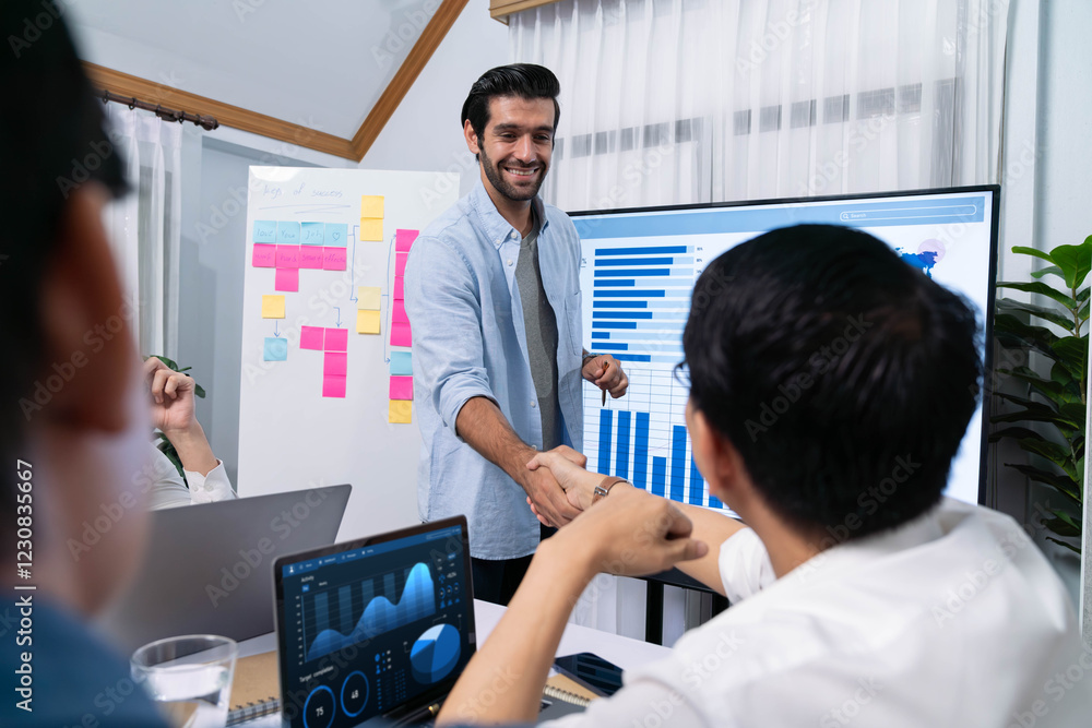 Leinwandbilder Analyst team leader shake hand with his colleague after successful data analysis meeting using FIntech software power with business intelligence or BI dashboard. Prudent