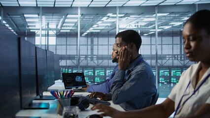 Data center software developer maintaining company network infrastructure by configuring and...