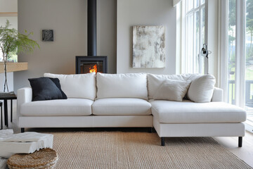 White corner sofa near fireplace. Scandinavian home interior design of modern living room 