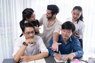 Group of diverse office worker employee working together on strategic business marketing planning in corporate office room. Positive teamwork in business workplace concept. Prudent