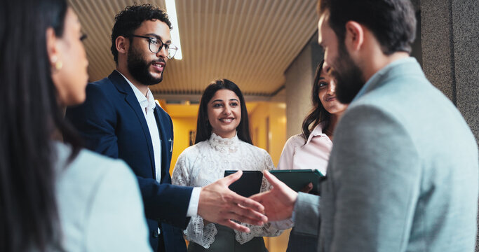 Smile, business people and shaking hands in office for greeting, b2b partnership or meeting. Handshake, cooperation and team introduction, welcome and hello at seminar hallway in hotel lobby at night