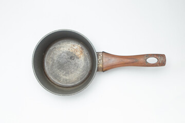 Grunge used cooking pot isolated on white background.Looks black and dirty.Kitchen tools concept.Copy space for text.For graphic design or banner background