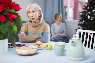 Portrait of a mature woman who took offense at her adult daughter after a quarrel