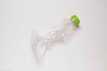 Close up of wrinkled and deflated used plastic drink bottles isolated on white background.Green environmental concept.Copy space for text.For graphic design and banner background