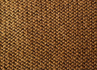 Texture of Mocha-coloured knitted fabric as background, top view
