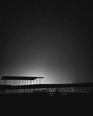 Dramatic Silhouette of a Structure Against a Night Sky